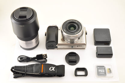 [US Duty Paid] SONY A6000 ILCE-6000Y SILVER w/ SELP1650 & SEL55210 SC: 1162 USA