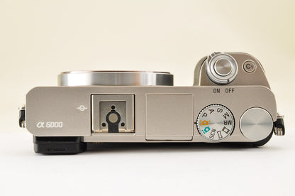 [US Duty Paid] SONY A6000 ILCE-6000Y SILVER w/ SELP1650 & SEL55210 SC: 1162 USA