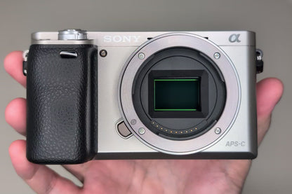 [US Duty Paid] SONY A6000 ILCE-6000Y SILVER w/ SELP1650 & SEL55210 SC: 1162 USA